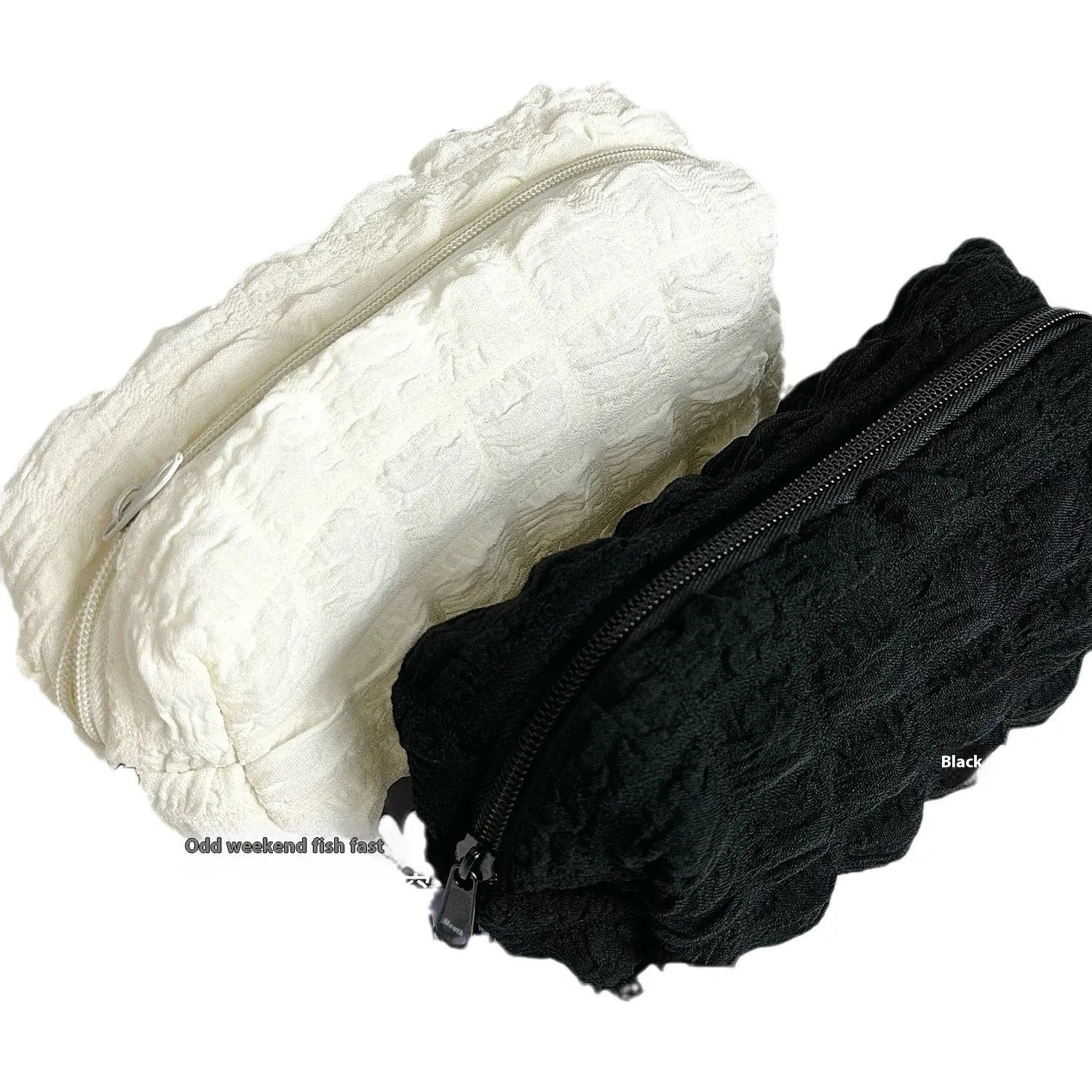 Beige and black fabric pencil case with cream puff design for organising pens and stationery.