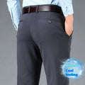 Men's straight-leg business casual trousers in elastic fabric, shown in black, available in waist sizes 29 to 52 inches.