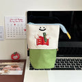 Korean style cartoon collapsible pencil case in Oxford fabric, shown in brown and green colours.