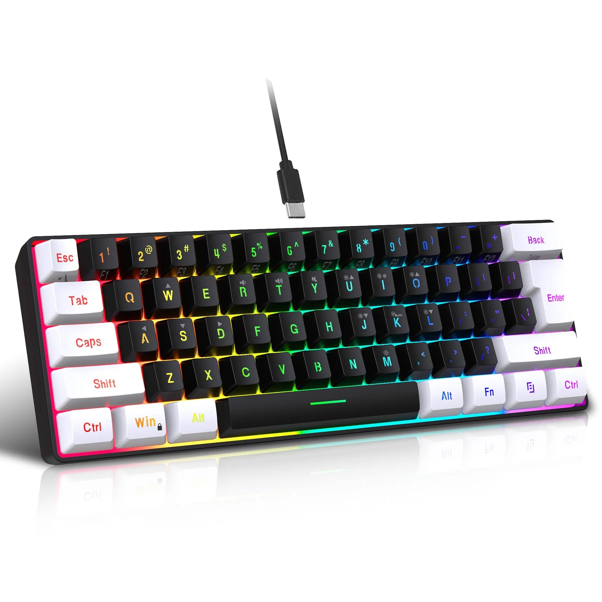 White and black wired 61-key USB membrane keyboard on a desk next to a laptop.