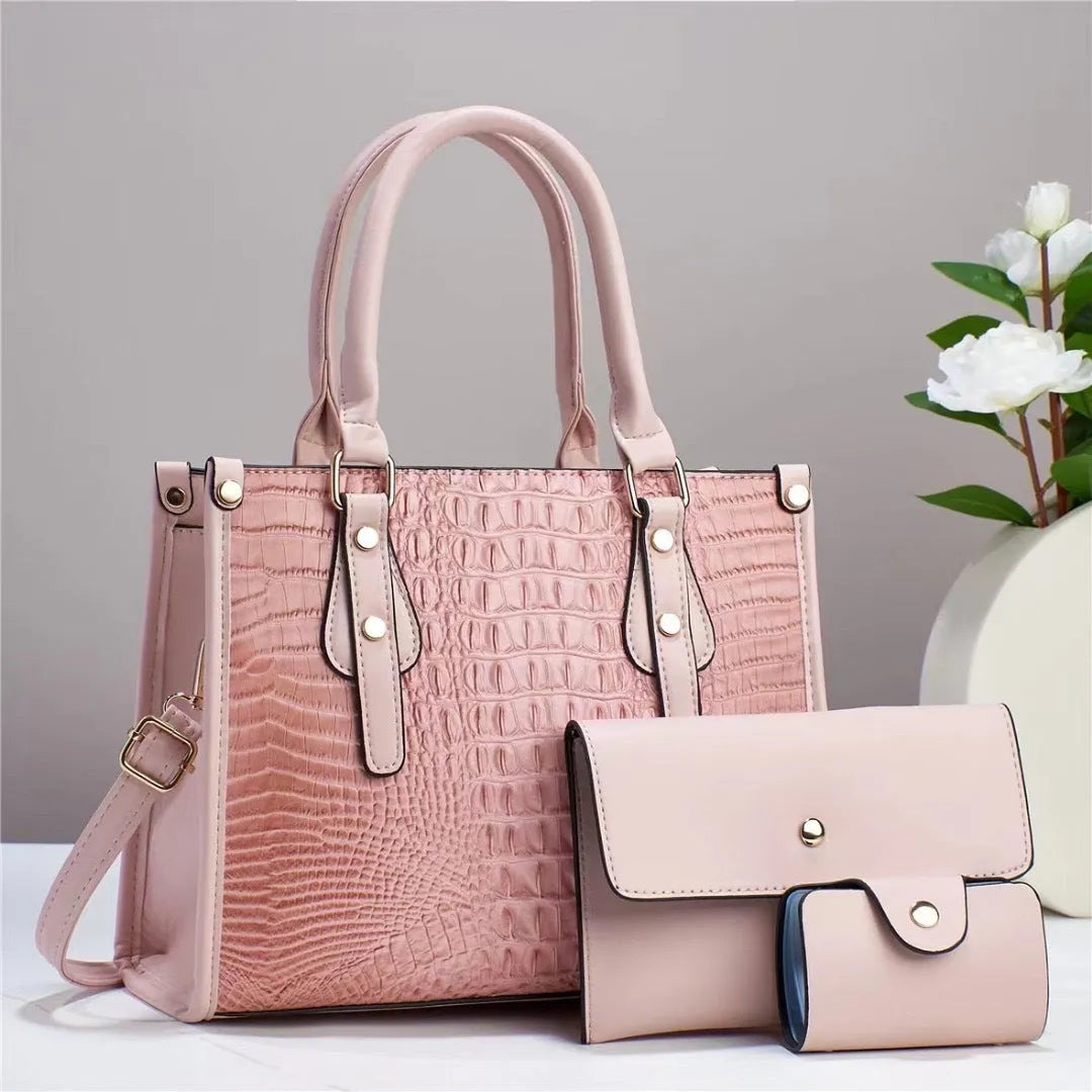 Contrast colour minimalist textured three-piece set showing crossbody bag, wallet, and card holder in burgundy.