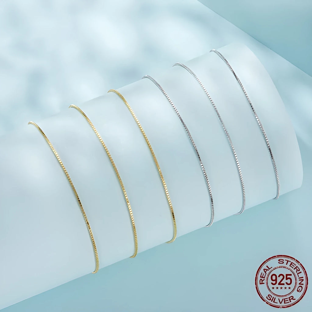 S925 sterling silver box chain necklace in silver colour, 40cm length on flat surface