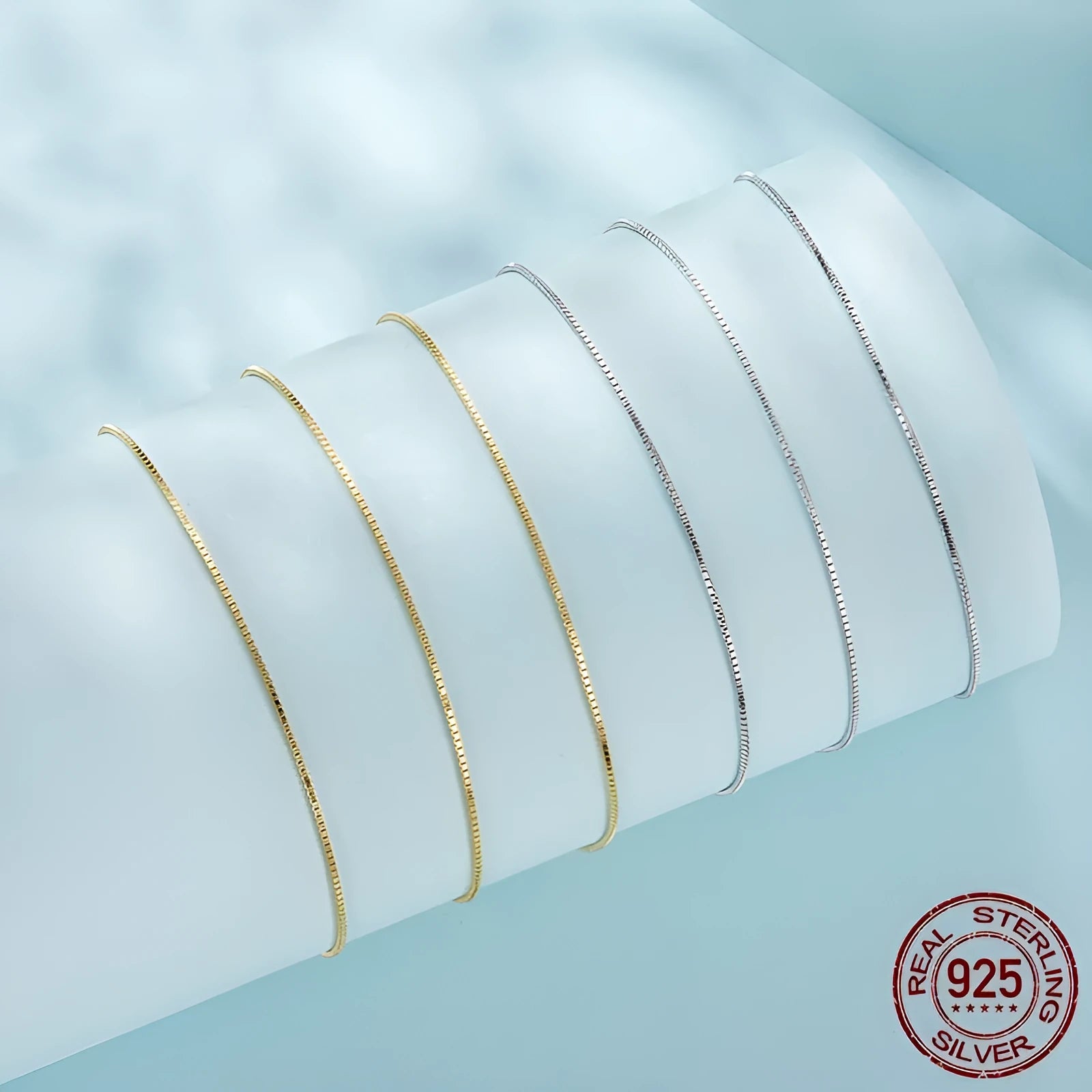 S925 sterling silver box chain necklace in silver colour, 40cm length on flat surface