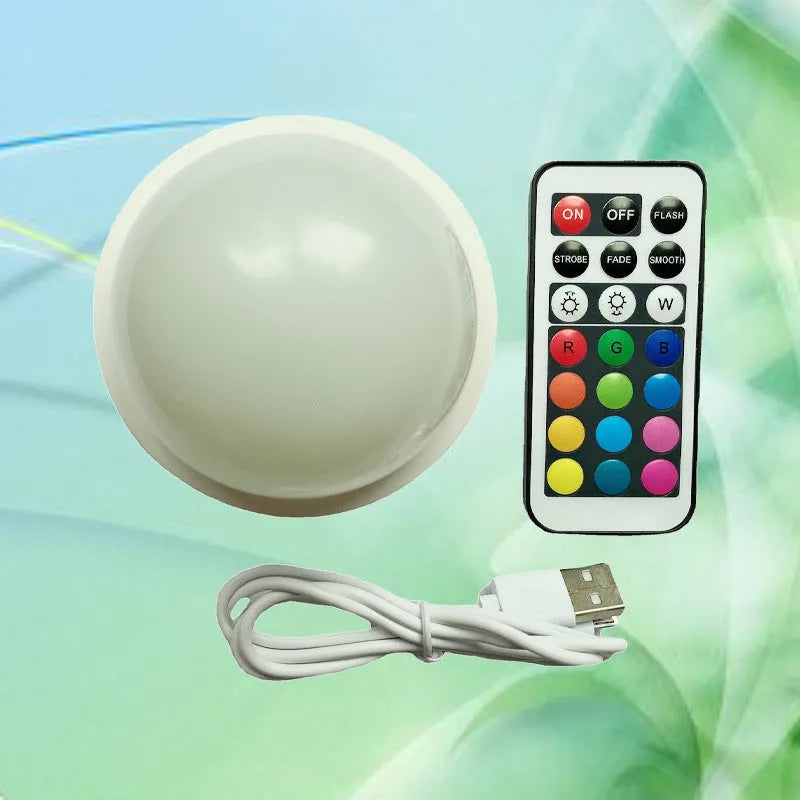 Colourful gradient 3D shooting night light with remote control on black surface