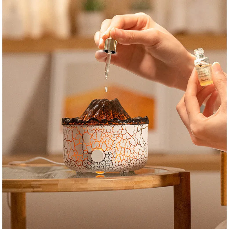 Volcano-shaped humidifier diffuser with LED flame lighting effect emitting mist puffs