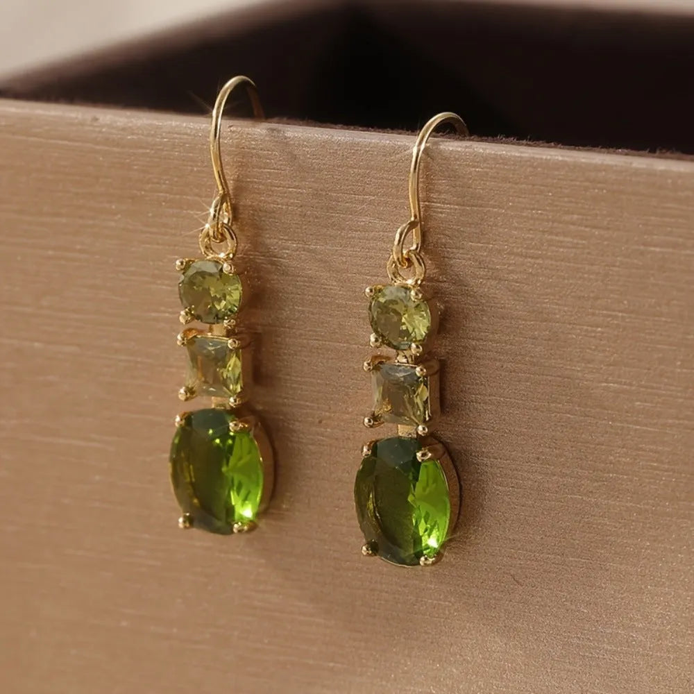 A pair of green geometric copper earrings with a quadrilateral shape and retro bohemian style.