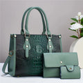PU leather three-piece luggage set showing crossbody bag, wallet, and card holder in minimalist texture