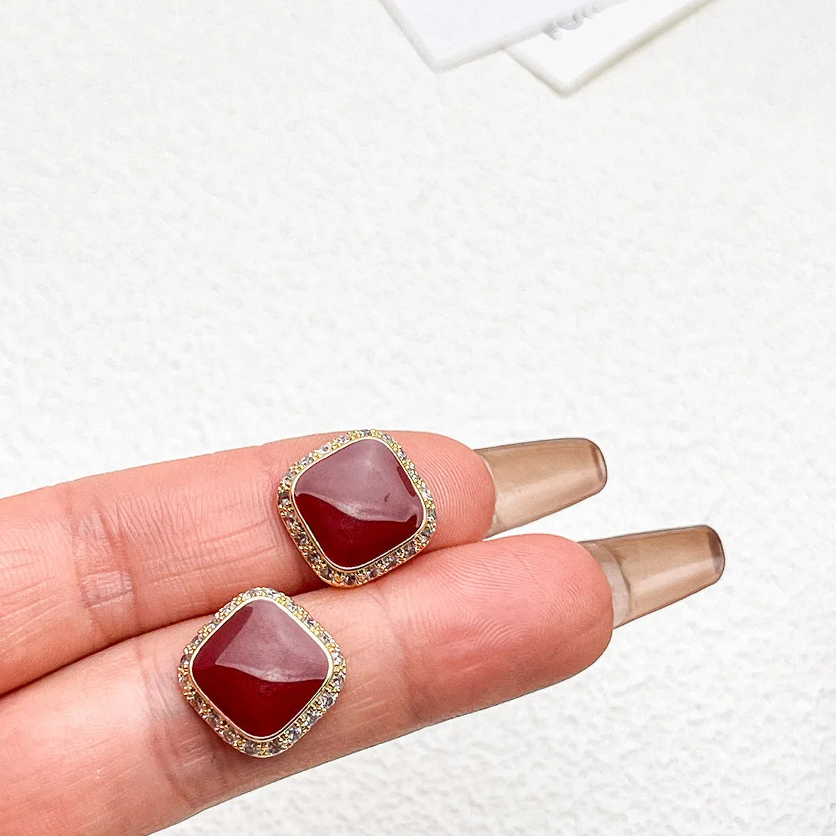 Retro red alloy earrings with geometric square inlaid design for women.