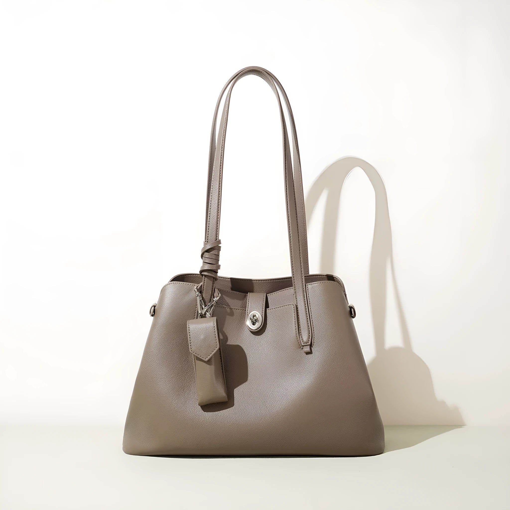 Large capacity genuine leather bucket bag for women in black with crossbody strap and patchwork detail