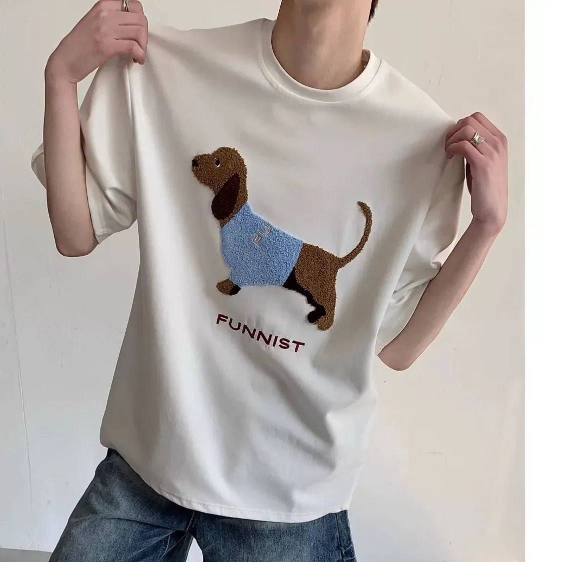 Men's grey cotton T-shirt with an embroidered brown sausage dog design on the front.