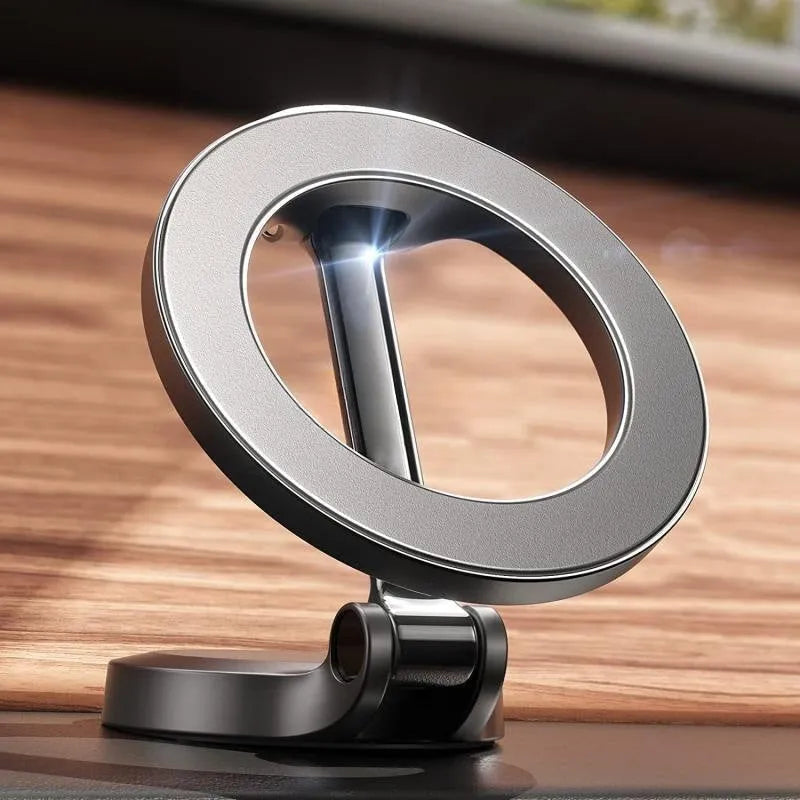 All-metal foldable magnetic car phone mount in Qian colour on a car dashboard.