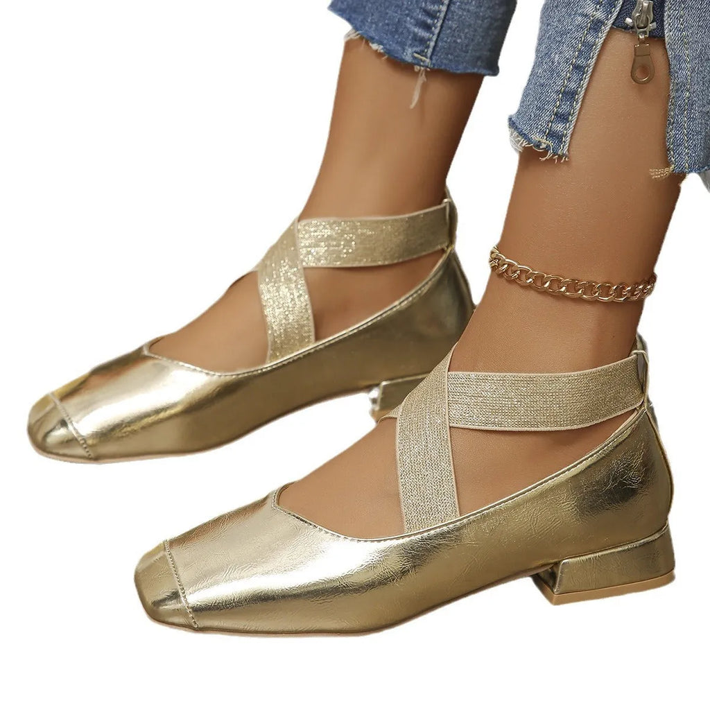 Gold slip-on overshoes with a square toe and low rubber heel, shown as shoe covers.
