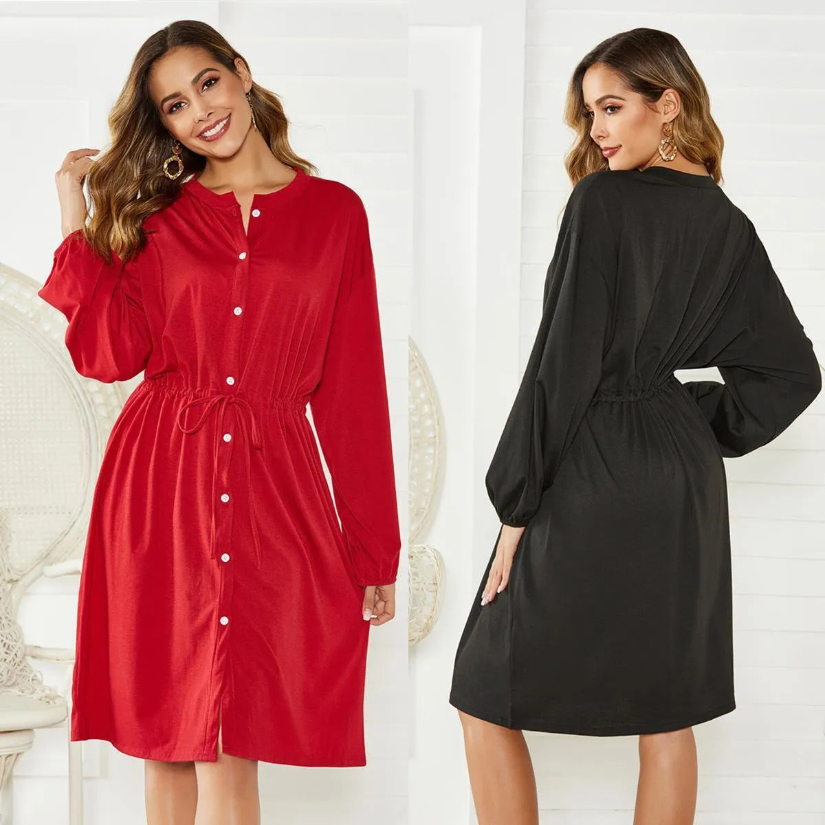 Black A-line midi dress with long sleeves, an elastic waist, and a matching cinching belt laid flat.