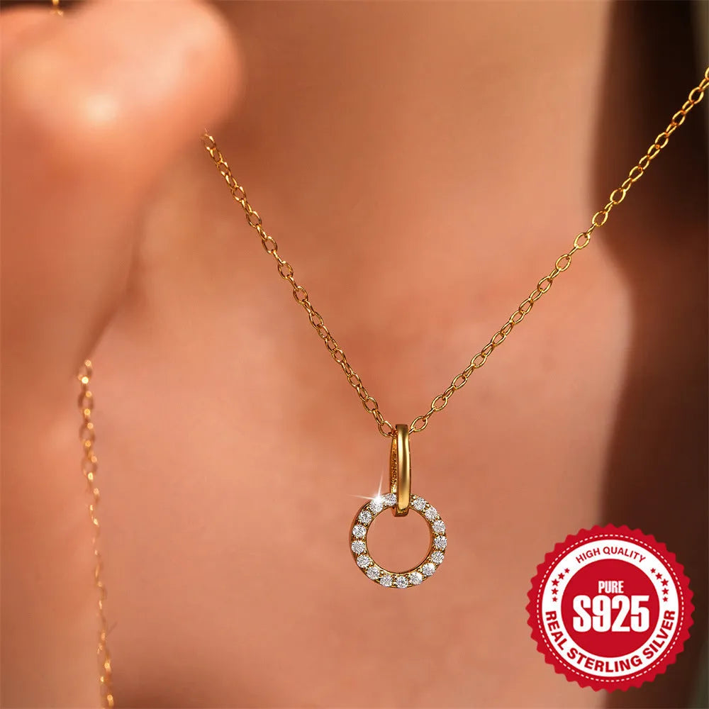 Gold-coloured geometric sterling silver pendant necklace with zircon detail on an adjustable chain.