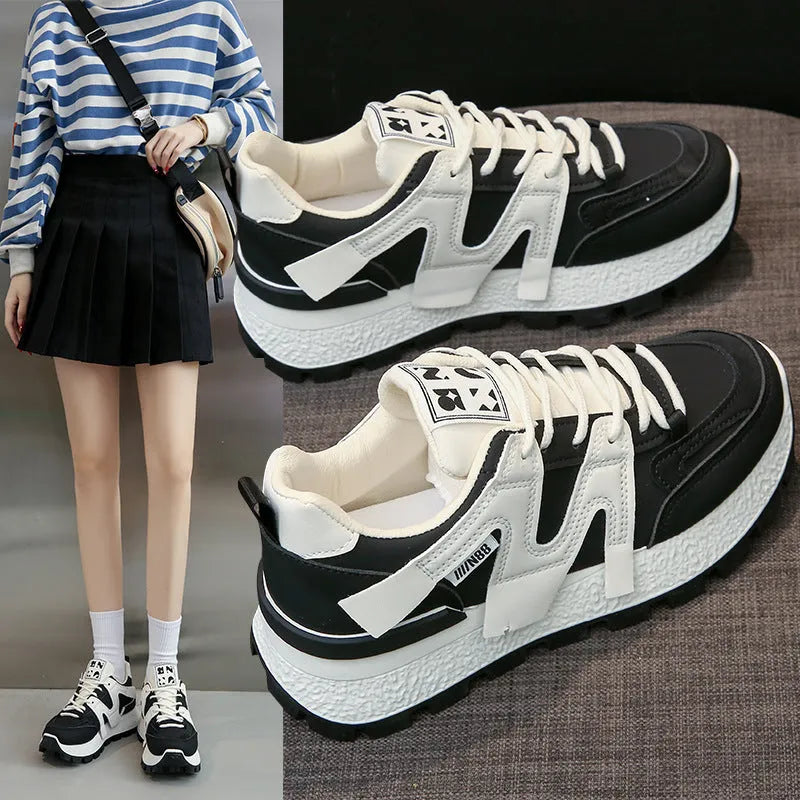 Women's low-top sneakers in white or black with artificial PU upper and rubber sole