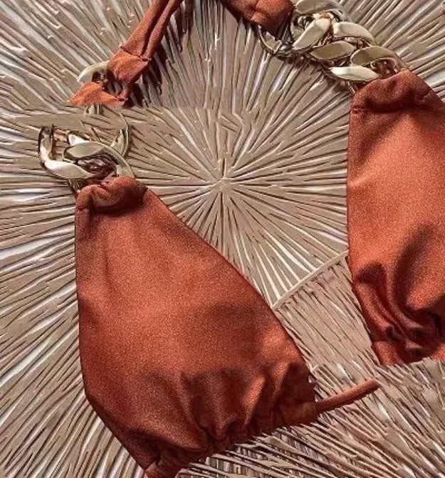 Brown women's tube-top bikini with adjustable ring straps and a split skirt for swimming.