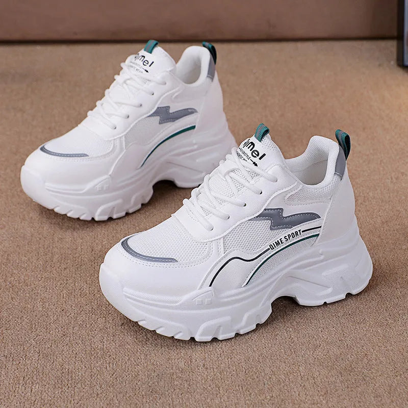 Women's white breathable dad shoes with lace-up front and cross shoulder straps on a rubber sole.