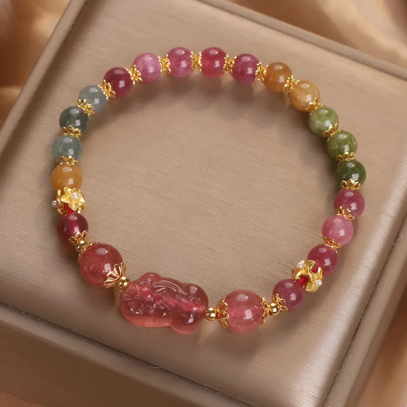 Pink and red candy colour crystal bracelet with tourmaline and strawberry quartz stones, 17 cm length.