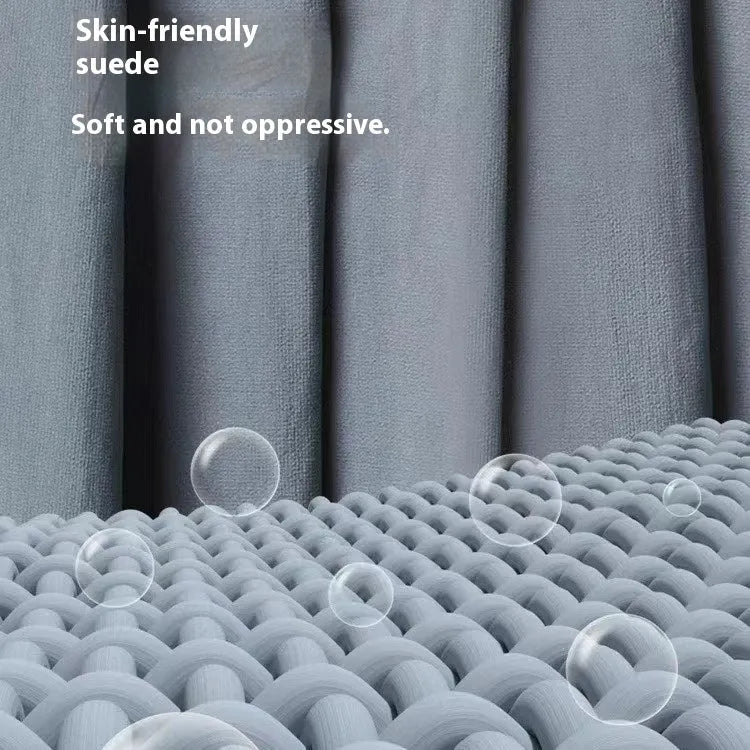 Blue lightweight mummy-style nylon sleeping bag with tapered foot, shown rolled up for travel.