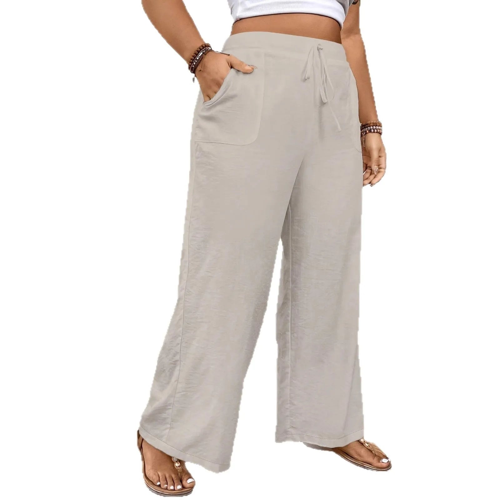 Drawstring wide leg loose fit women trousers in khaki colour with side pockets and drawstring waist.