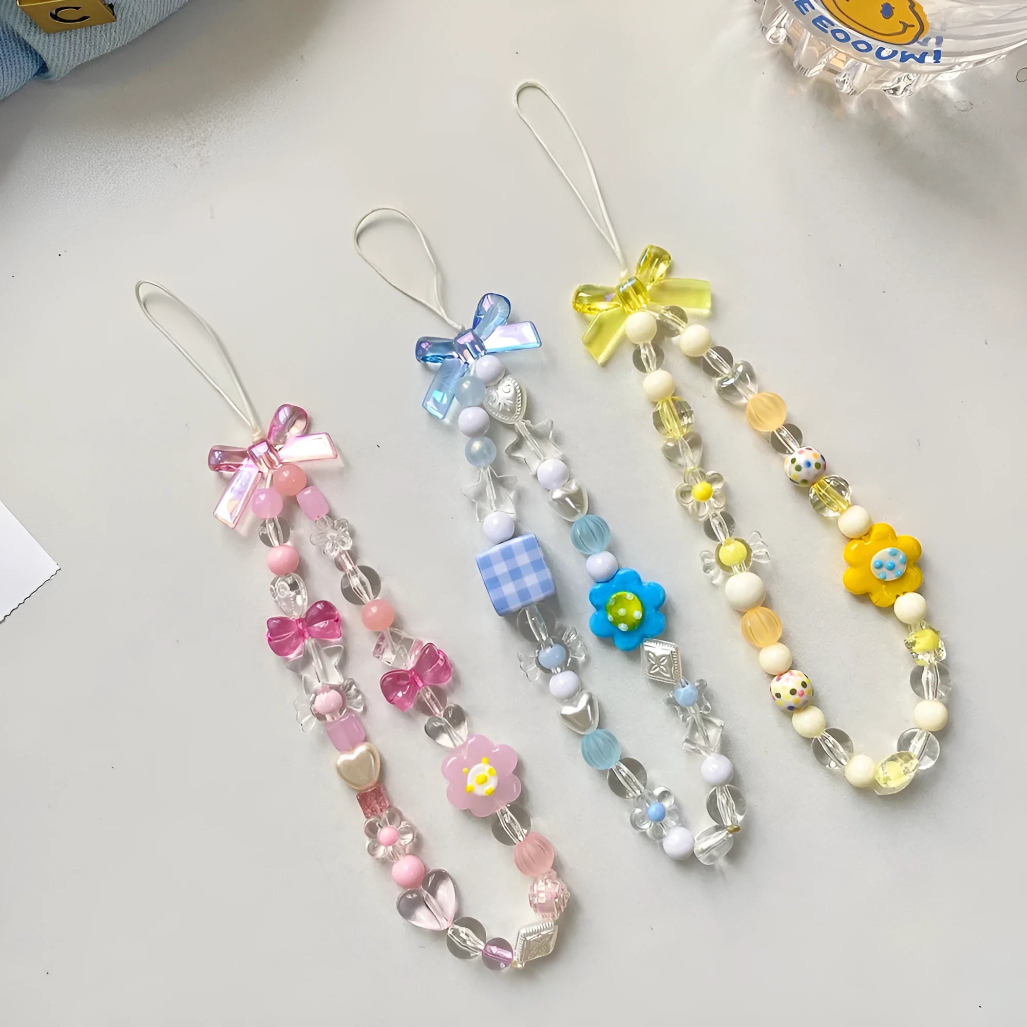 Plastic resin beaded mobile phone lanyard with flower beads in yellow