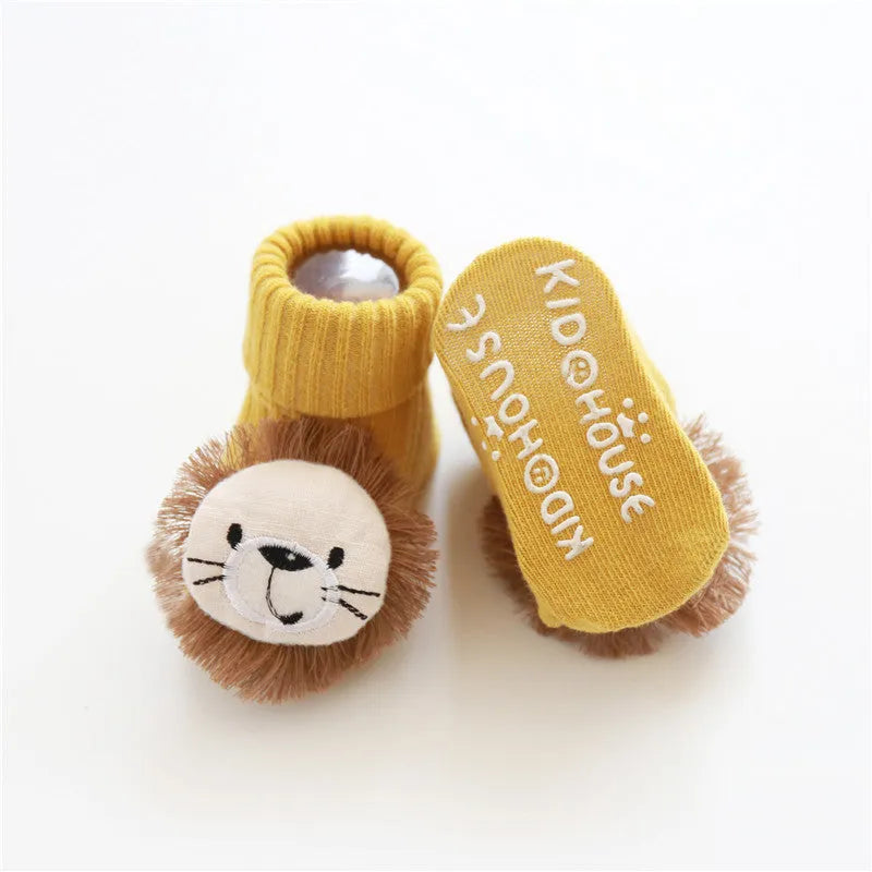 Cotton baby floor socks in various colours and patterns including pink bows, grey stars, and panda design.