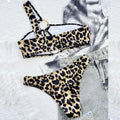 Women's hollow leopard print with polka dots bikini top and shorts set on a mannequin.