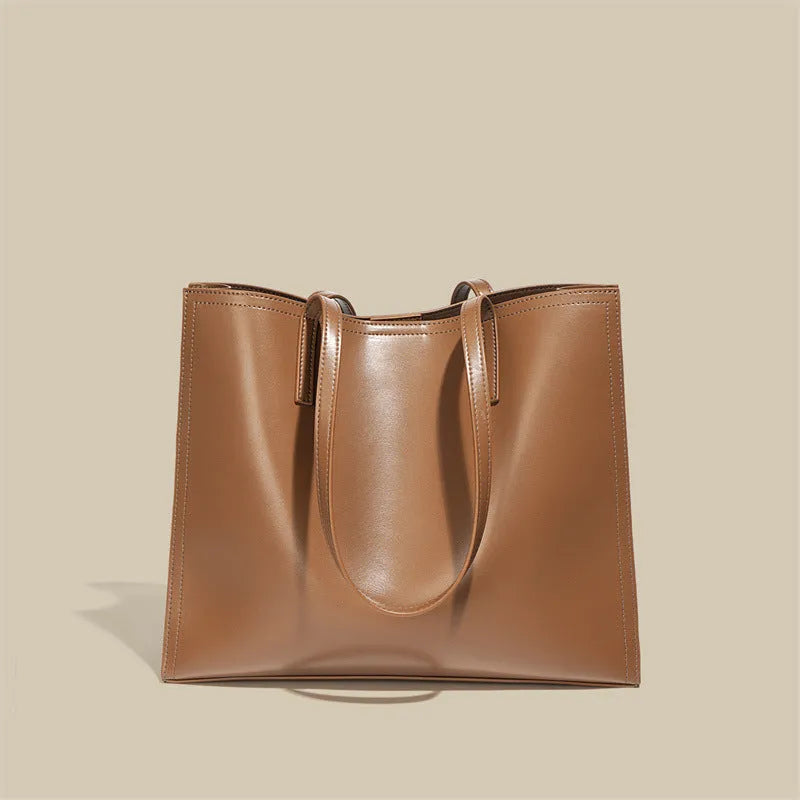 Women's brown genuine leather one shoulder handbag with horizontal square shape showing interior organisation compartments