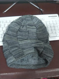 Wool knitted beanie hat in khaki, dome top, brimless style on model