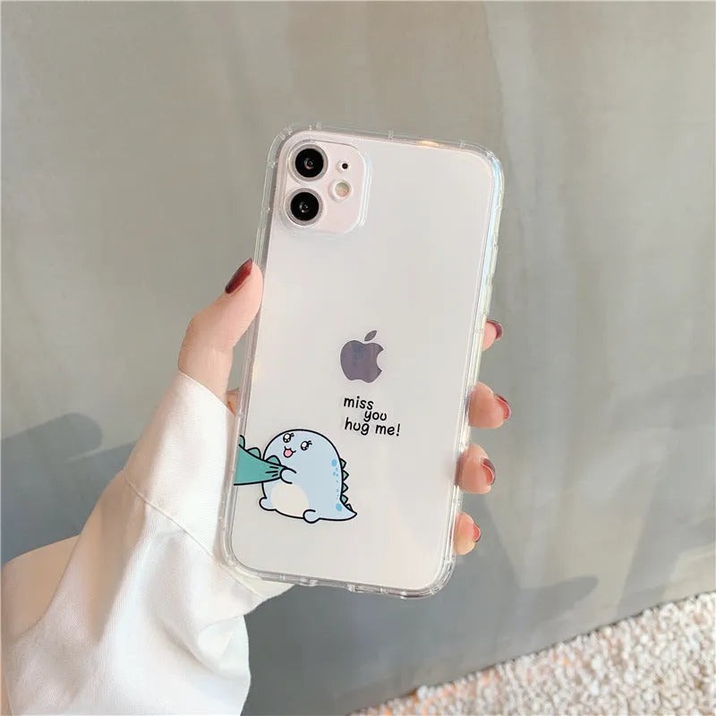 Clear transparent iPhone case with green dinosaur design on back, showing airbag-style edges.