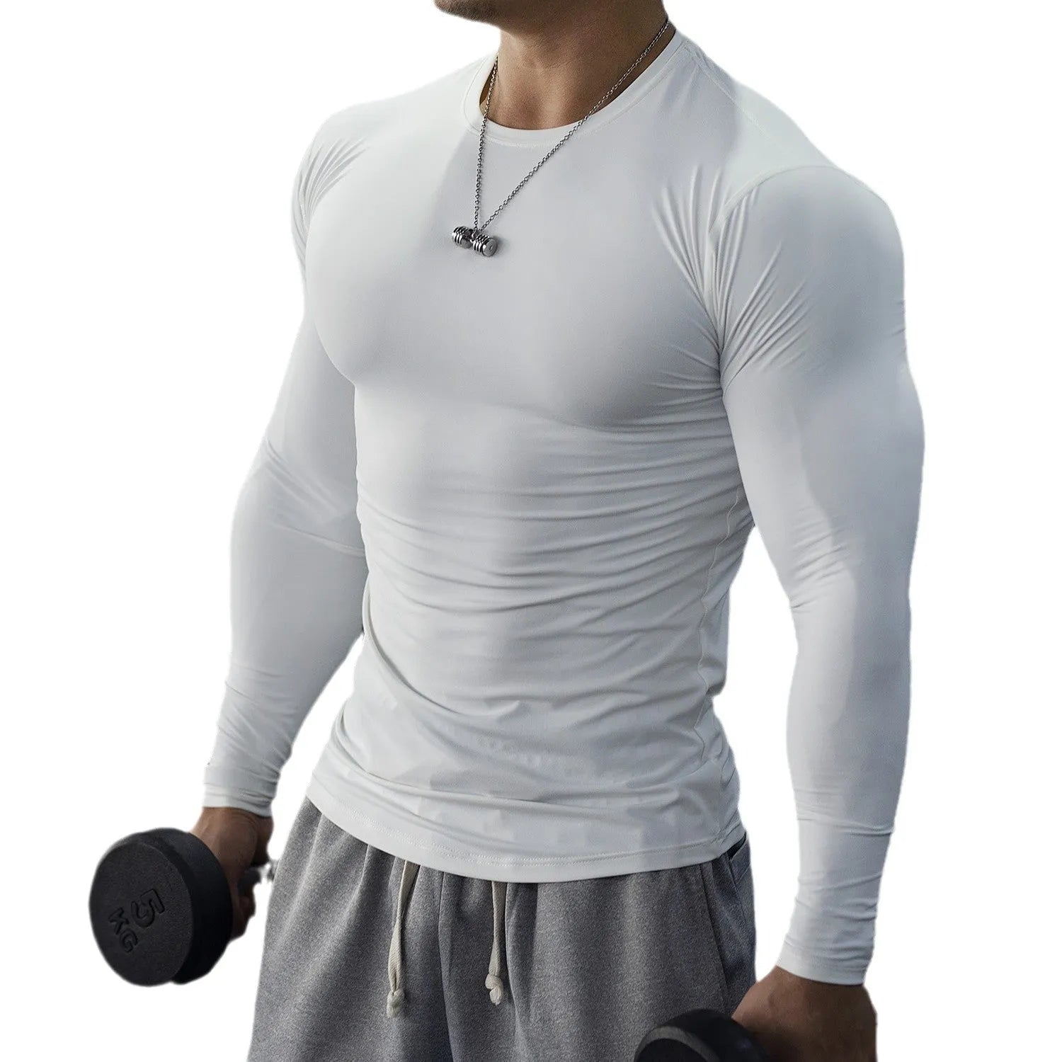 Man wearing black slim fit long sleeve fitness tights for running or gym workout.
