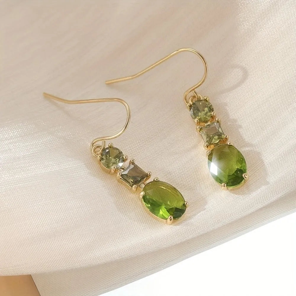 A pair of green geometric copper earrings with a quadrilateral shape and retro bohemian style.