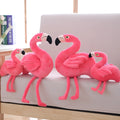 Pink flamingo plush toy with short plush fabric, filled with PP cotton, sitting on a surface