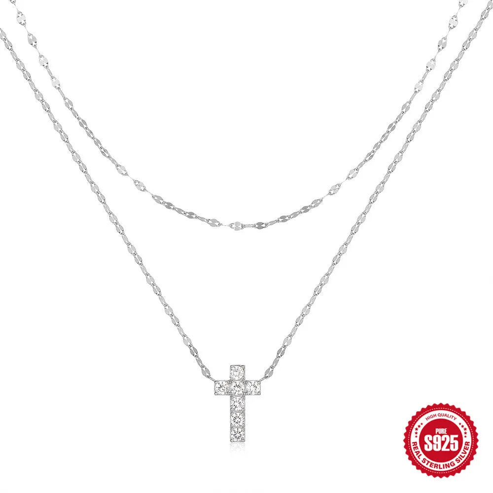 S925 sterling silver double layer cross pendant necklace with diamond cut detail on a clavicle chain.