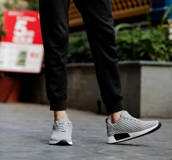 Men's Malcom low-top sneaker with mesh fabric upper and MD sole in black, grey, and white