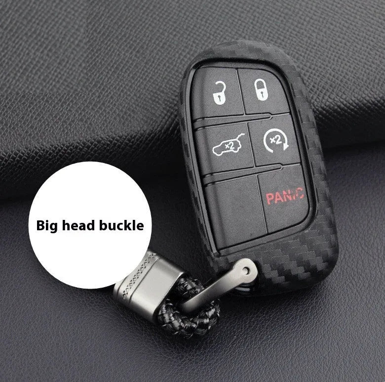 Black silicone car key case with carbon fibre pattern for Dodge, Chrysler, Fiat remote, shown with buckle option.