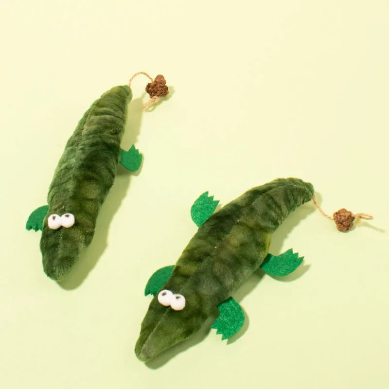 Green plush alligator-shaped cat toy with catnip and peppermint scent.