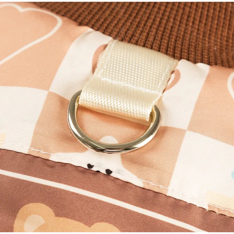 Quilted pet vest with warm brown bear and heart prints, integrated leash ring, designed for dogs and cats in autumn and winter.