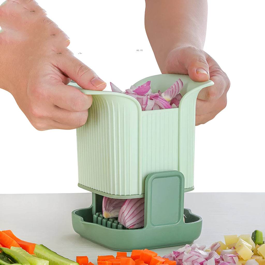 Green manual vegetable chopper with stainless steel blades for onions and potatoes.