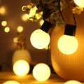 10-metre solar-powered festival string lights with 40 warm white bulbs on black cable for outdoor tent lighting