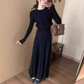 Dark grey knitted sweater and skirt set with a raised 3D pattern, shown as a complete artistic retro outfit.