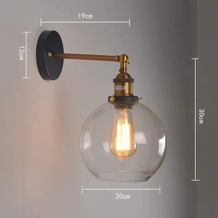 20cm round retro glass wall lamp with an aluminium holder in amber finish