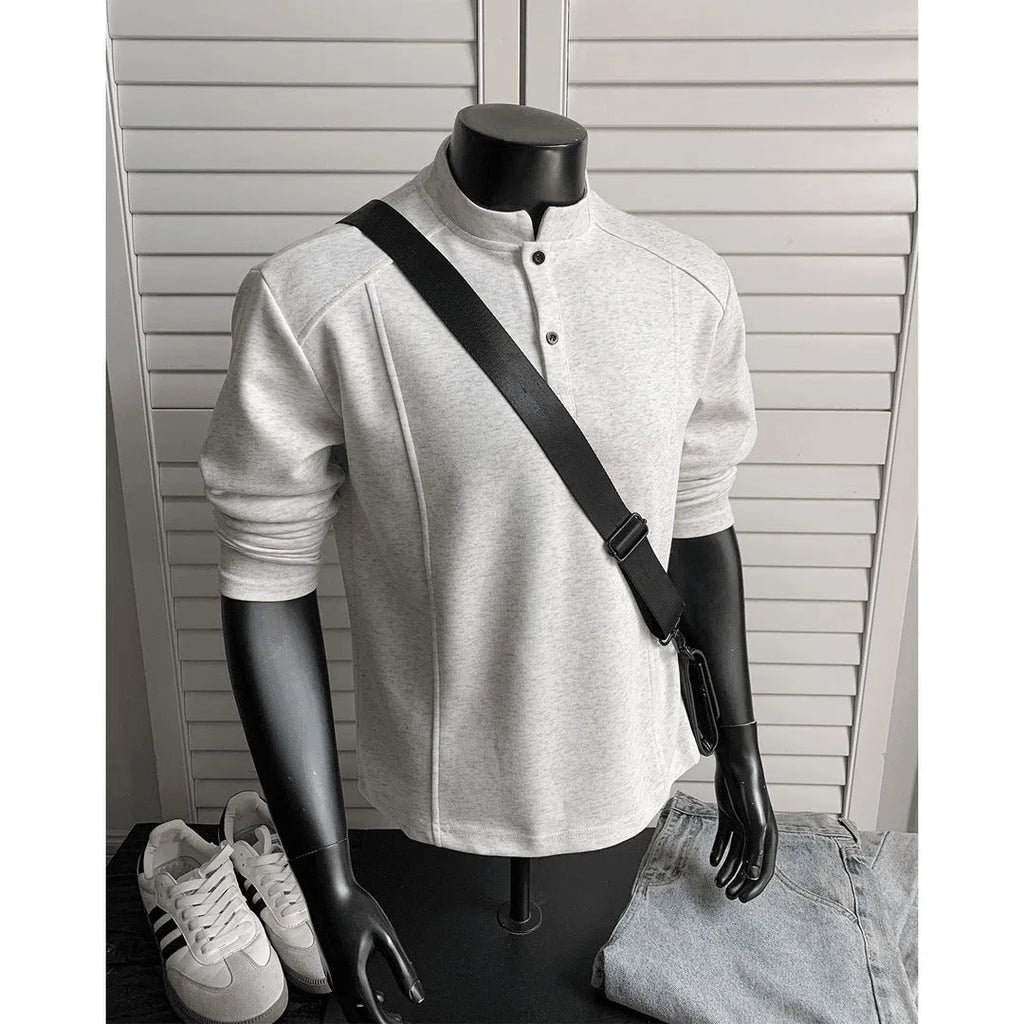 Men's loose-fit long-sleeve polo shirt with a stand-up collar and asymmetric patchwork design in Chinese cotton.