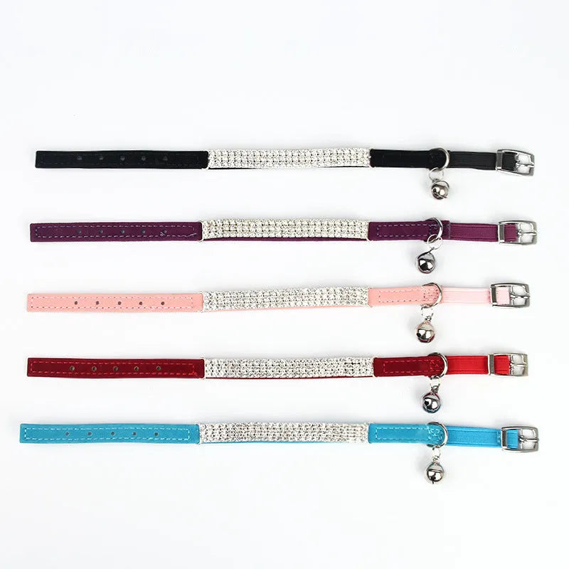 Red velvet cat collar with rhinestones, showing adjustable buckle set to a 25cm length.