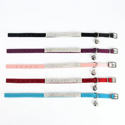 Red velvet cat collar with rhinestones, showing adjustable buckle set to a 25cm length.