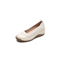 Beige cowhide leather platform slip-on pumps with round head and thick sole on white background