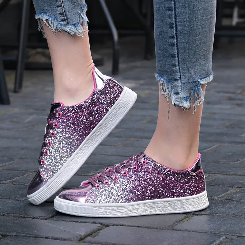 Women's low-top casual shoes with colourful sequin upper, round toe, and lace-up front in black, gold, or pink.