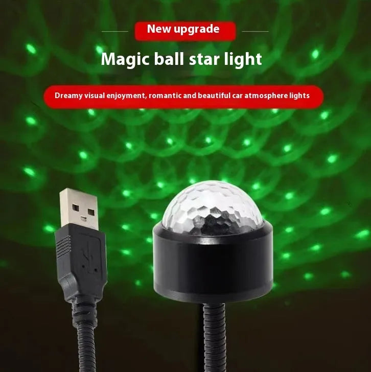 Black USB car atmosphere projection star light with ABS plastic housing plugging into vehicle dashboard