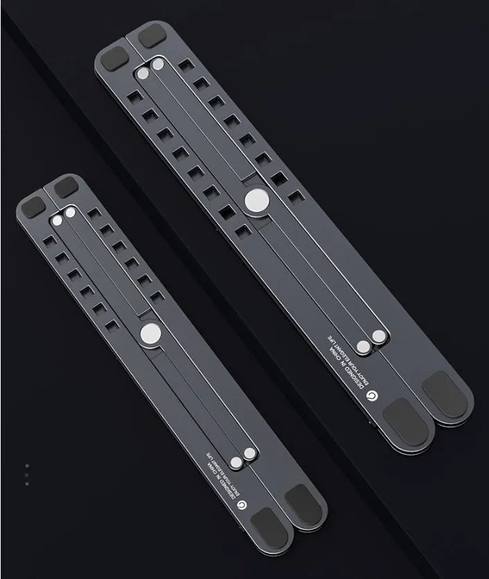 Aluminium foldable laptop stand shown in silver colour, adjusted to a mid-height position.