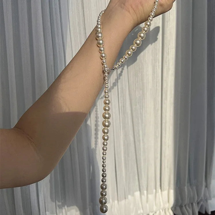 Y-shaped gradient long pearl necklace with copper geometric pendant, white and grey hues, 61-70cm chain